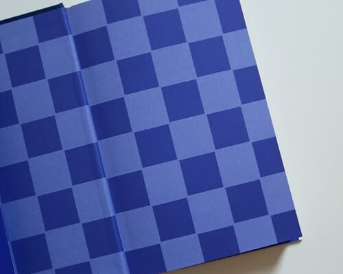 Blue checkered pattern on book pages.